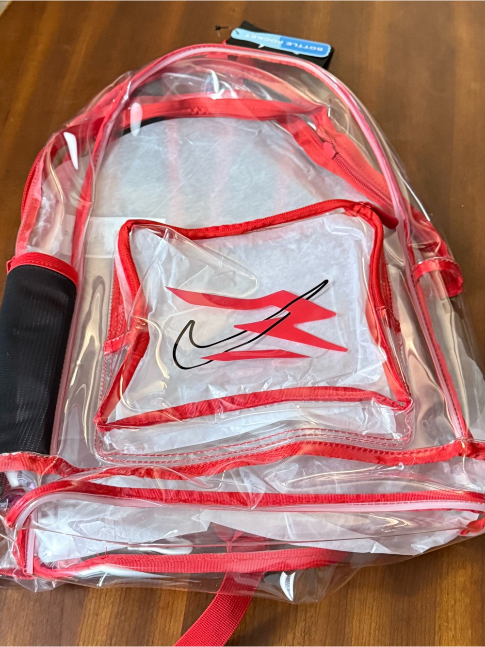 Nike Clear Backpack with Red Accents and Black Logo